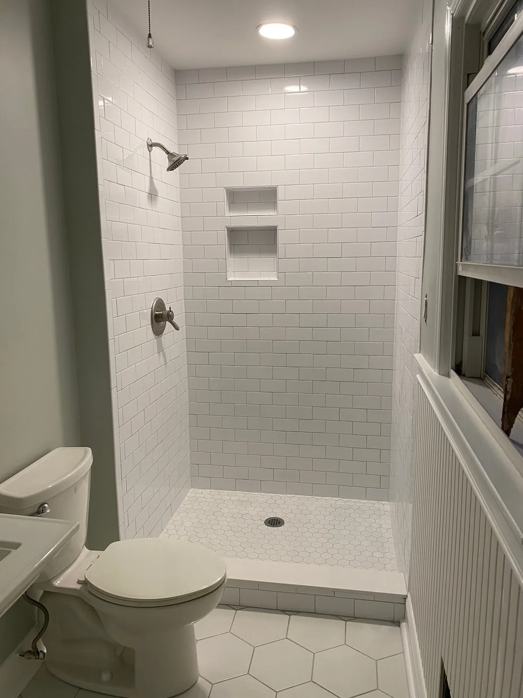 Detailed custom tile shower by Betts Designs and Renovations