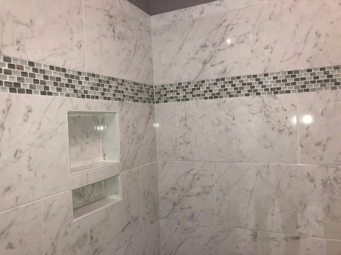 Completed custom tile shower renovation by Betts Designs