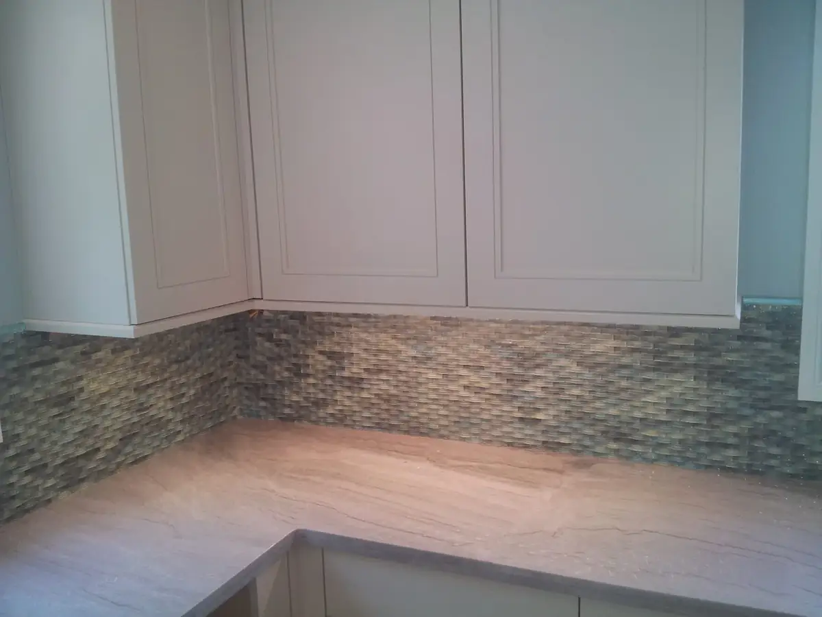 Kitchen work surface with a mosaic tile backsplash