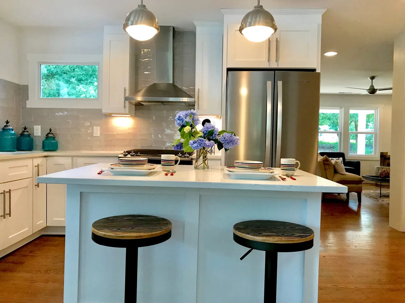 Open kitchen renovation with island and coordinated finishes